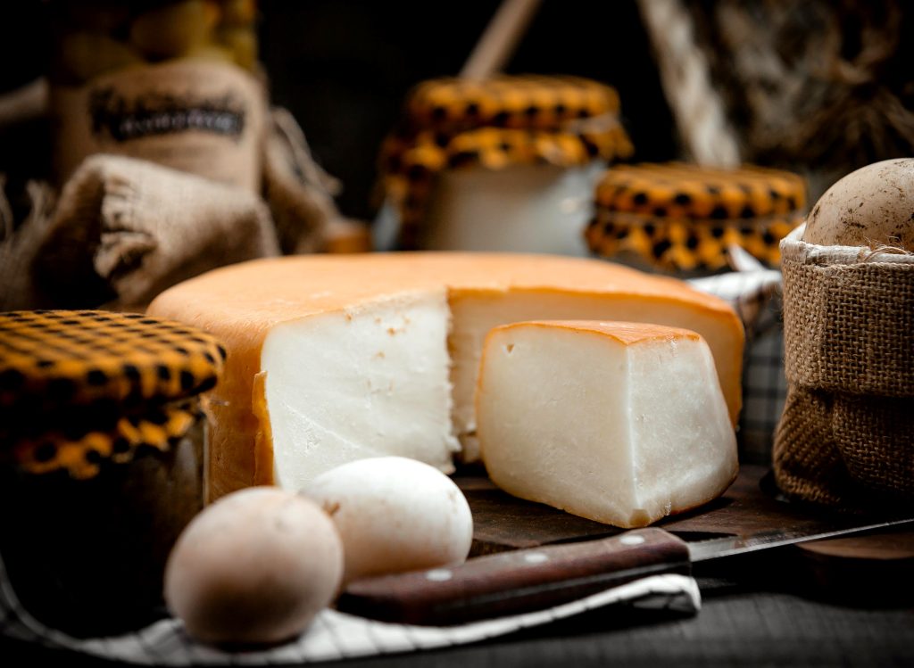 smoked cheese on a wooden hemp